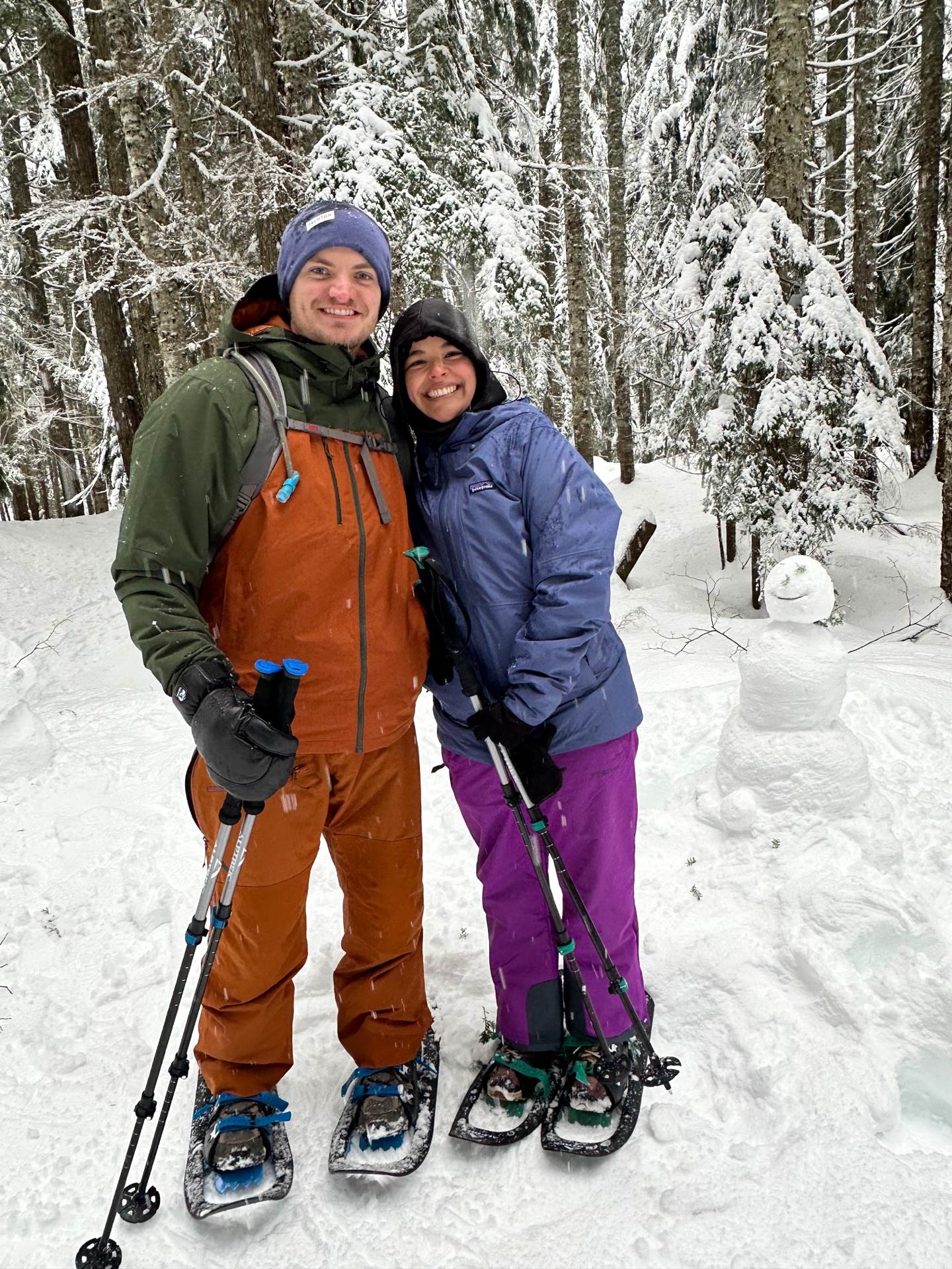 Sophia and Lucas snowshoeing in snowy forest